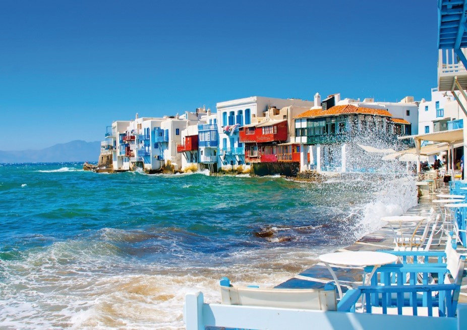 Chairs & tables beside the Little Venice harbour, an attraction on the ASIT Mykonos tours packages