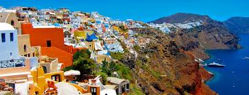 Colourful sprawl of houses on the side of the volcanic caldera on the Greek island of Santorini